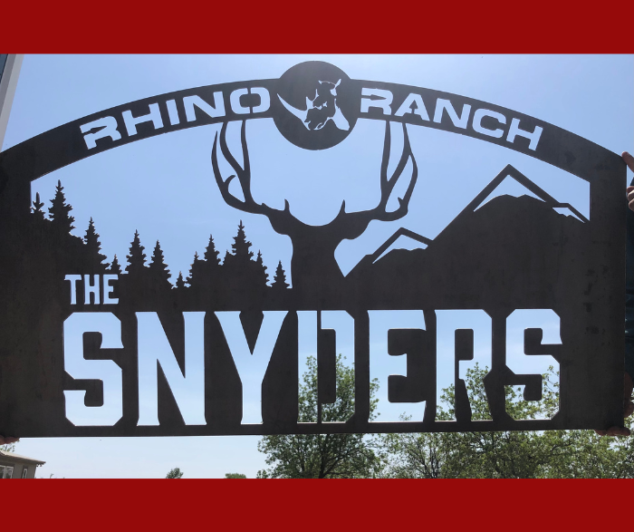 custom metal business sign made with love by HL Guest Handmade for the snyders at rhino ranch with buck, trees, mountains, and rhino