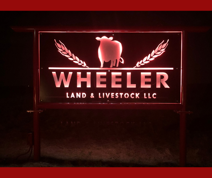 custom metal business sign made with love by HL Guest Handmade for Wheeler Land and Livestock LLC with fed steer and wheat heads
